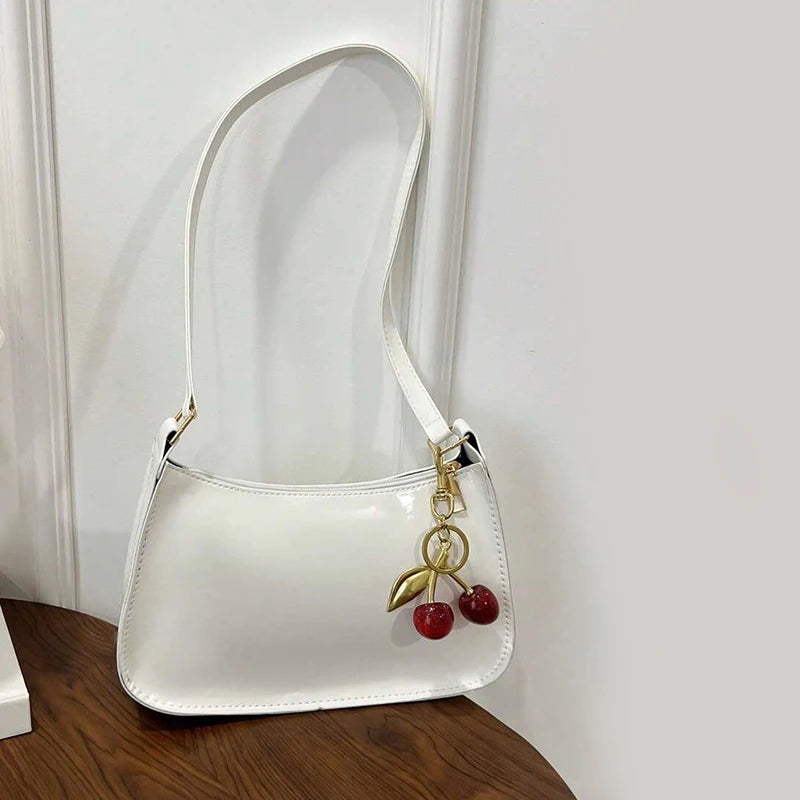 Women's PU Leather Handbag Versatile Fashion Solid Color Cherry Pendant Shoulder Bag Casual Commuting Bag Underarm Bag